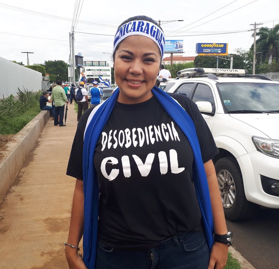 Irlanda Jerez, wearing a Nicaragua headband and a Desobedencia Civil T-shirt